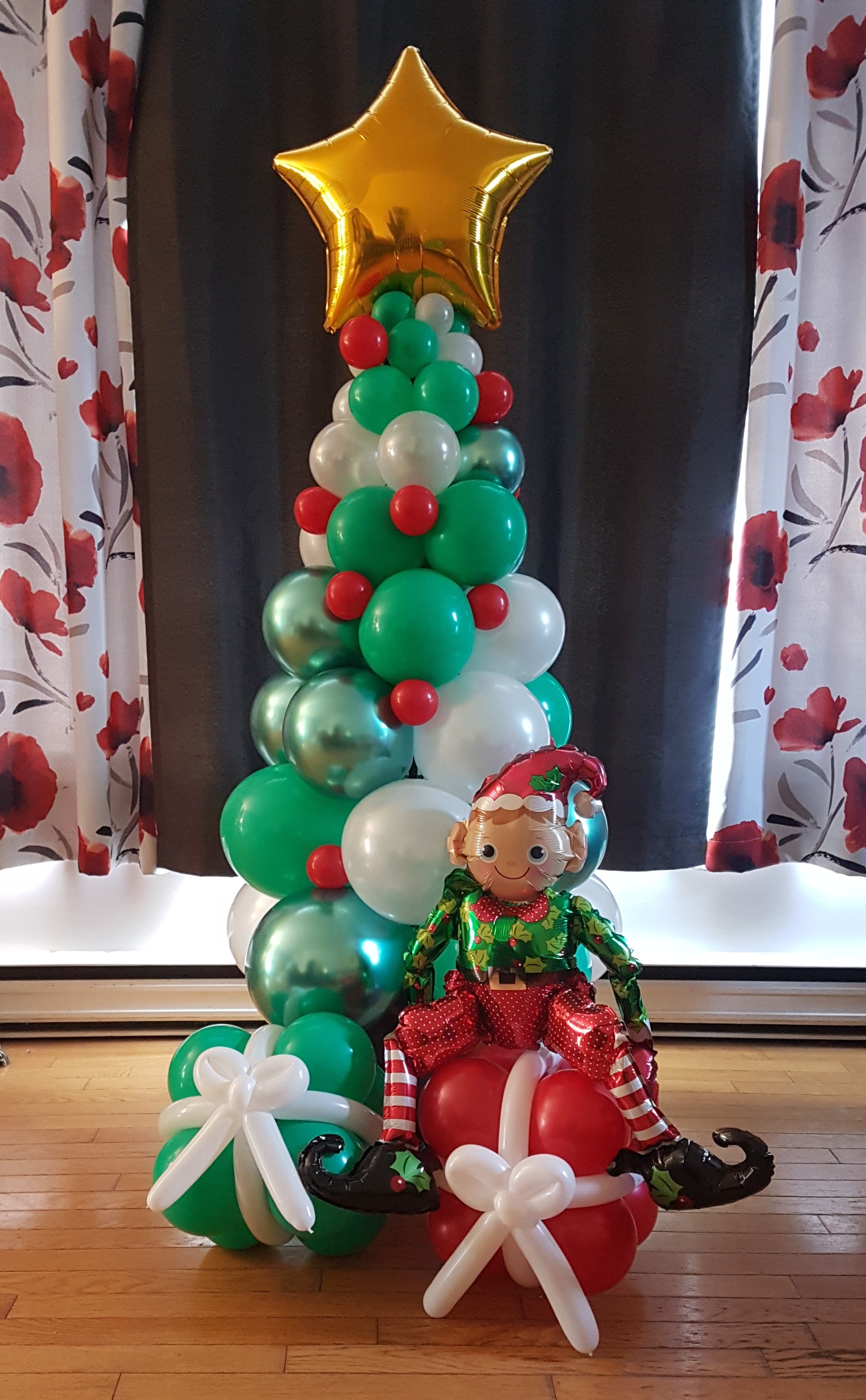 Christmas tree balloon sculpture with elf decoration